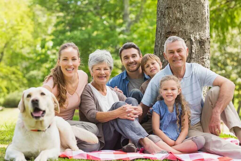 Family outdoors with dog